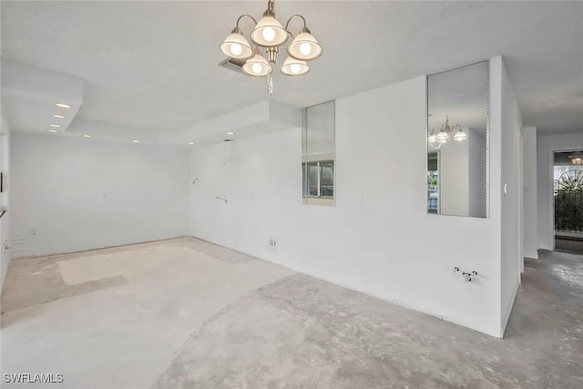 spare room featuring an inviting chandelier, recessed lighting, and unfinished concrete flooring