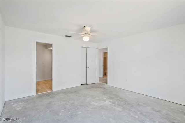 unfurnished bedroom with visible vents, a ceiling fan, a closet, and unfinished concrete floors