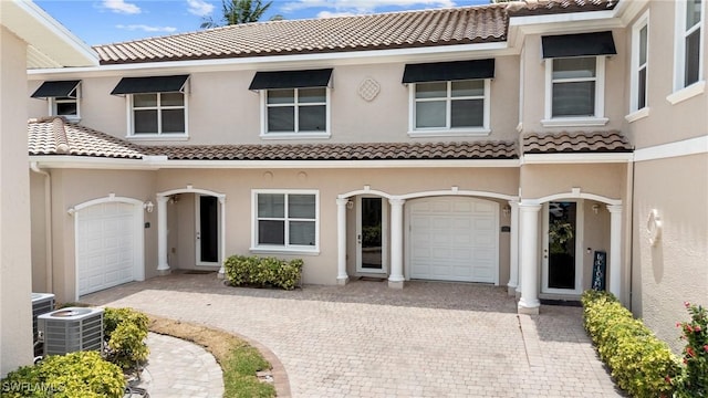 4938 Viceroy St Unit 107, Cape Coral, FL 33904 - townhome / multi-family property featuring decorative driveway, a tile roof, and stucco siding