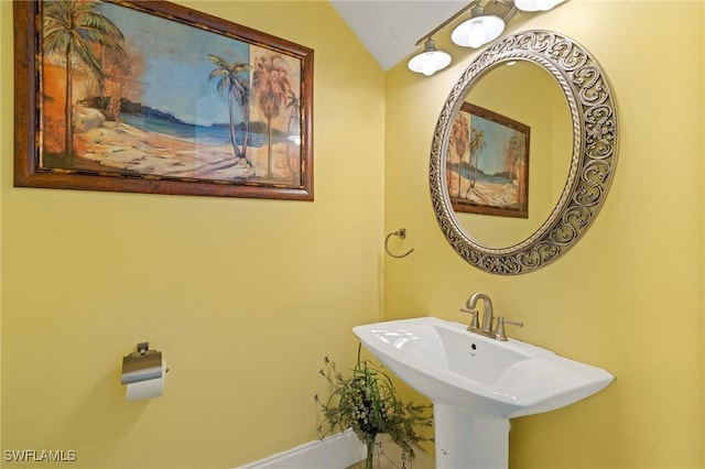 4938 Viceroy St Unit 107, Cape Coral, FL 33904 - bathroom featuring vaulted ceiling and a sink