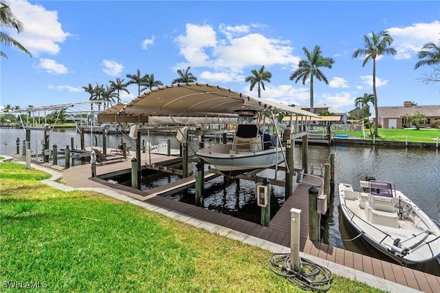 4938 Viceroy St Unit 107, Cape Coral, FL 33904 - view of dock featuring boat lift, a water view, and a yard