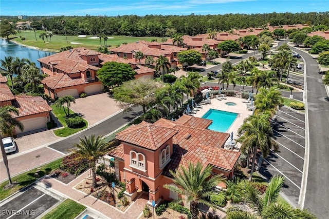 birds eye view of property featuring a water view and view of golf course