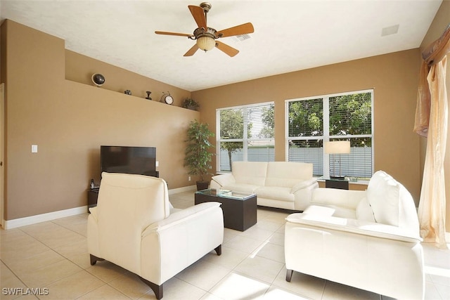 1725 SE 10th Pl, Cape Coral, FL 33990 - living room featuring baseboards, a ceiling fan, and light tile patterned floors