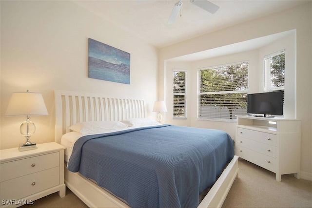 1725 SE 10th Pl, Cape Coral, FL 33990 - carpeted bedroom featuring a ceiling fan