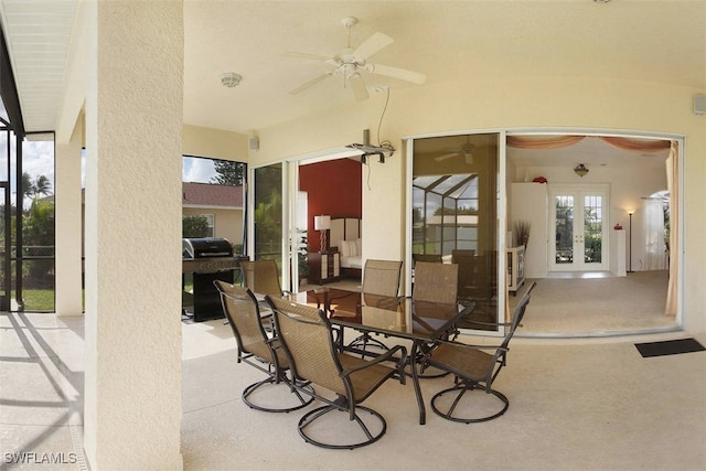 1725 SE 10th Pl, Cape Coral, FL 33990 - view of patio / terrace with a ceiling fan, grilling area, french doors, and outdoor dining space