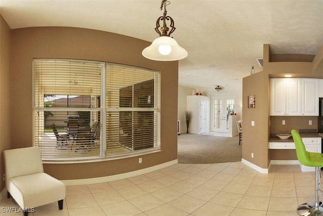 1725 SE 10th Pl, Cape Coral, FL 33990 - unfurnished dining area featuring baseboards and light tile patterned flooring