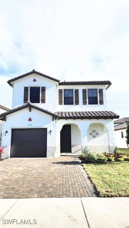 5736 Cassidy Ln, Ave Maria, FL 34142 - view of front of property with a garage, decorative driveway, stucco siding, and a tile roof