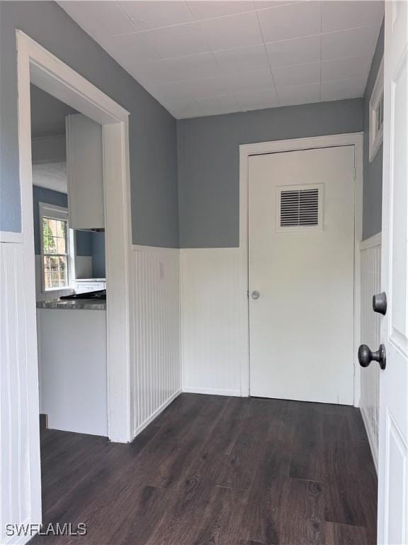 2739 Michigan Ave, Fort Myers, FL 33916 - hallway featuring wainscoting and dark wood finished floors