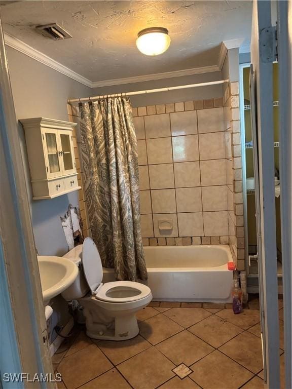2739 Michigan Ave, Fort Myers, FL 33916 - full bath featuring tile patterned floors, ornamental molding, shower / bath combo, toilet, and a sink