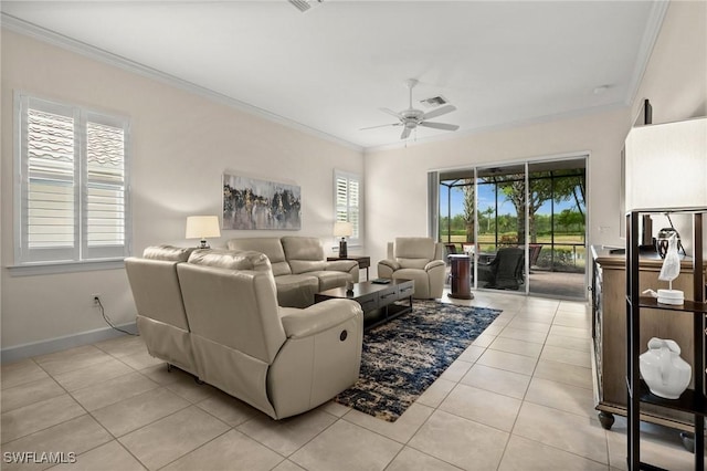 living room featuring visible vents, crown molding, a ceiling fan, light tile patterned floors, and baseboards