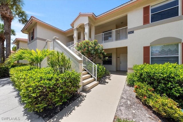 6645 Huntington Lakes Cir Unit 202, Naples, FL 34119 - view of building exterior with stairs