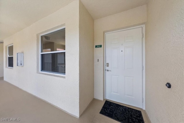 6645 Huntington Lakes Cir Unit 202, Naples, FL 34119 - property entrance with stucco siding