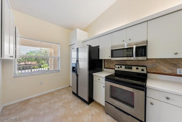 6645 Huntington Lakes Cir Unit 202, Naples, FL 34119 - kitchen featuring light countertops, white cabinetry, appliances with stainless steel finishes, and decorative backsplash