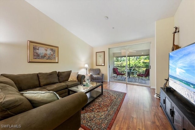 6645 Huntington Lakes Cir Unit 202, Naples, FL 34119 - living area with baseboards, lofted ceiling, and dark wood-style floors