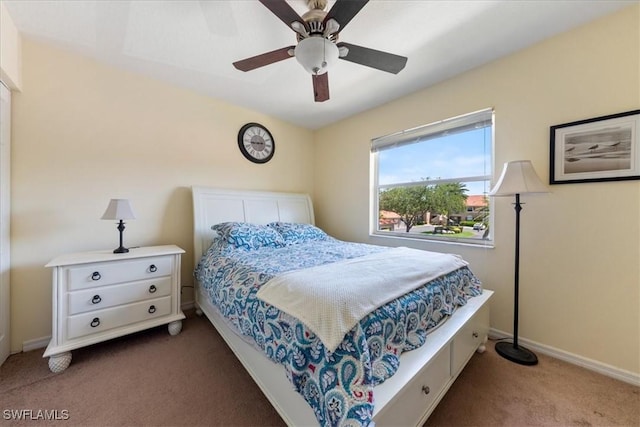 6645 Huntington Lakes Cir Unit 202, Naples, FL 34119 - carpeted bedroom with baseboards and a ceiling fan