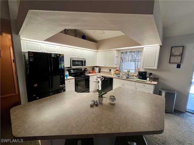 kitchen featuring white cabinetry, light carpet, a sink, and black appliances