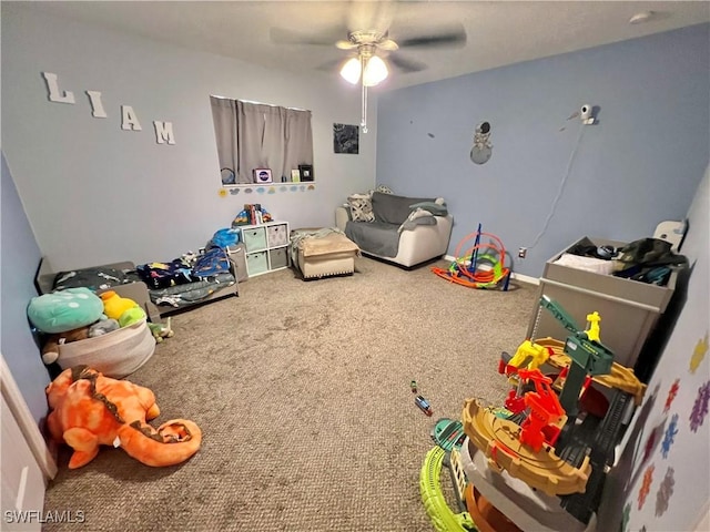 rec room with carpet floors and ceiling fan