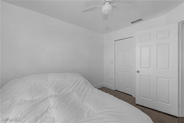 3646 Pine Oak Cir Unit 102, Fort Myers, FL 33916 - bedroom with a ceiling fan, visible vents, baseboards, a closet, and dark wood-type flooring