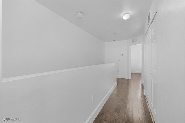 3646 Pine Oak Cir Unit 102, Fort Myers, FL 33916 - corridor featuring baseboards, wood finished floors, and visible vents