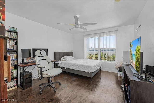 3646 Pine Oak Cir Unit 102, Fort Myers, FL 33916 - bedroom with baseboards and wood finished floors