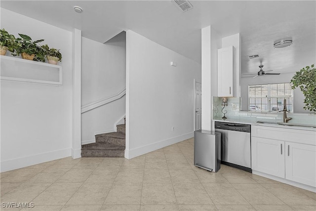 kitchen with visible vents, dishwasher, a sink, light countertops, and white cabinets