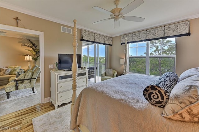 bedroom with visible vents, crown molding, wood finished floors, access to exterior, and ceiling fan