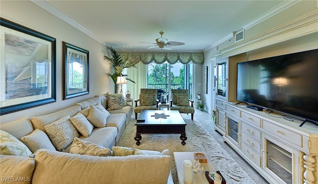 living room featuring a ceiling fan, visible vents, and ornamental molding