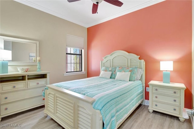 bedroom with crown molding, ceiling fan, and light wood-style flooring