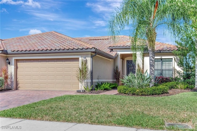 view of front facade with a front lawn, a garage, stucco siding, decorative driveway, and a tiled roof