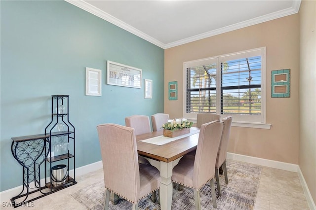 dining space with crown molding, baseboards, and light tile patterned flooring