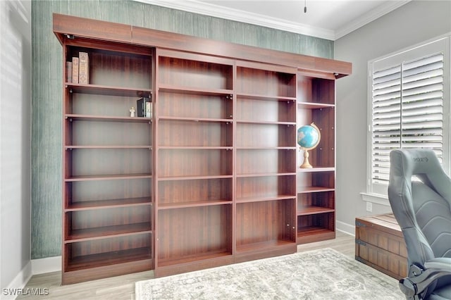 office featuring baseboards, ornamental molding, and wood finished floors