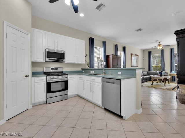 12156 Ledgewood Cir, Fort Myers, FL 33913 - kitchen featuring a ceiling fan, stainless steel appliances, open floor plan, and a sink
