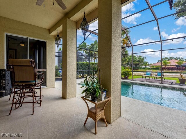 12156 Ledgewood Cir, Fort Myers, FL 33913 - outdoor pool featuring a patio, a ceiling fan, and glass enclosure