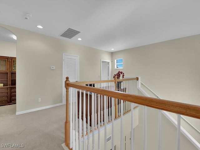 12156 Ledgewood Cir, Fort Myers, FL 33913 - hallway featuring light colored carpet, visible vents, an upstairs landing, and baseboards