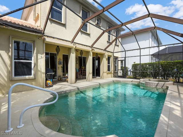 12156 Ledgewood Cir, Fort Myers, FL 33913 - view of pool with glass enclosure, a patio, and a pool with connected hot tub