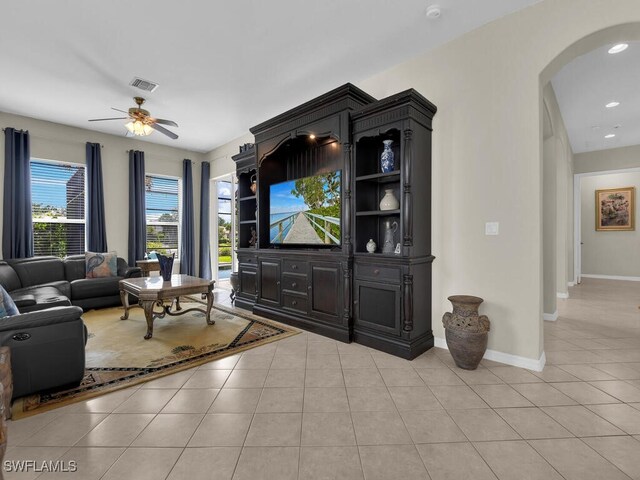 12156 Ledgewood Cir, Fort Myers, FL 33913 - living area with ceiling fan, visible vents, light tile patterned flooring, and arched walkways