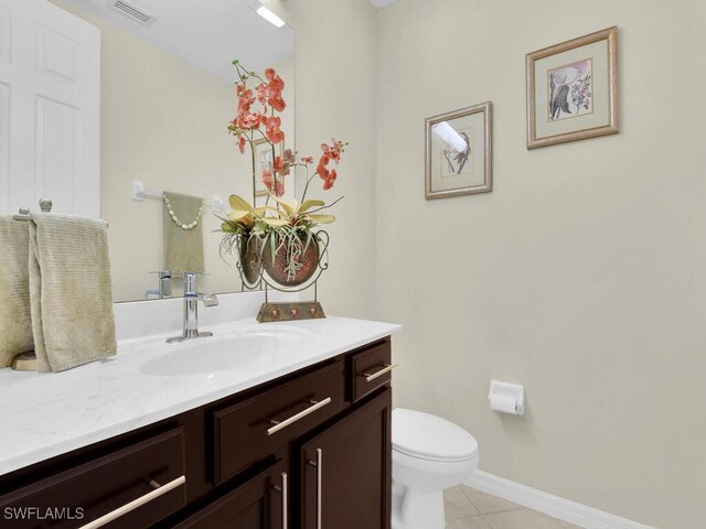 12156 Ledgewood Cir, Fort Myers, FL 33913 - bathroom featuring toilet, visible vents, baseboards, tile patterned flooring, and vanity