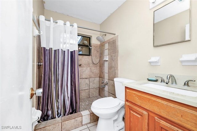 full bath with vanity, tile patterned flooring, a stall shower, and toilet