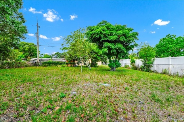 view of yard with fence