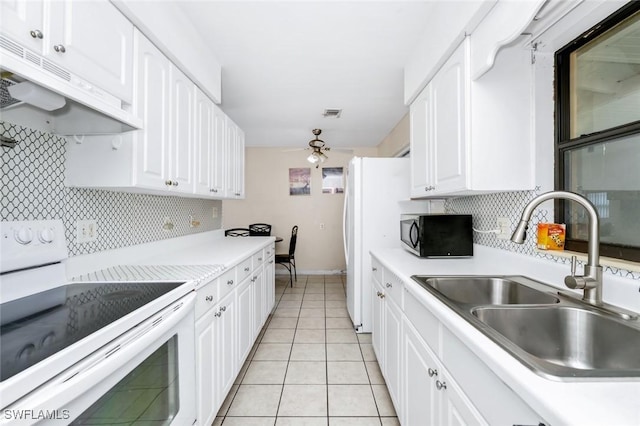 kitchen with white range with electric cooktop, light countertops, under cabinet range hood, a sink, and backsplash