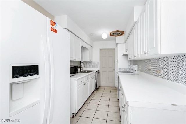 kitchen featuring decorative backsplash, appliances with stainless steel finishes, a sink, light tile patterned floors, and light countertops