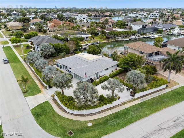 bird's eye view featuring a water view and a residential view
