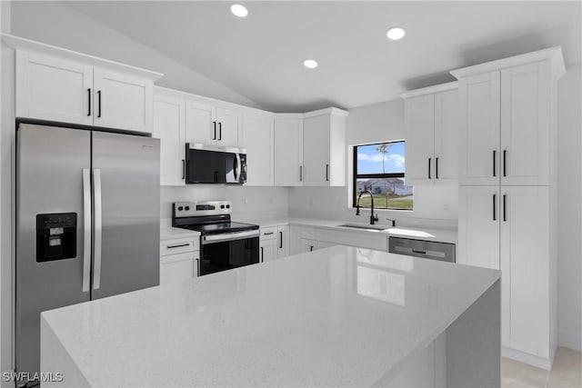 kitchen featuring a sink, appliances with stainless steel finishes, recessed lighting, and white cabinetry