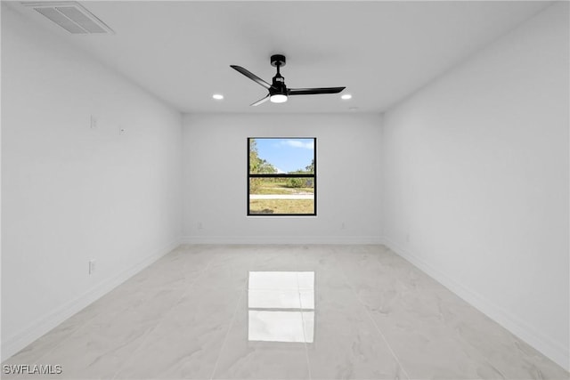 empty room with marble finish floor, ceiling fan, recessed lighting, and visible vents