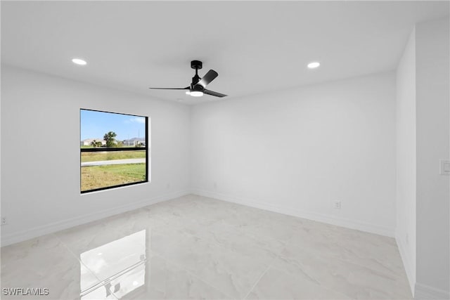 unfurnished room with recessed lighting, a ceiling fan, and baseboards