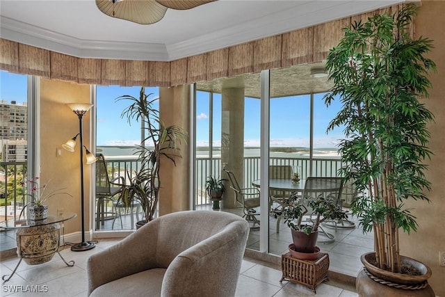 sunroom / solarium with crown molding and tile patterned flooring