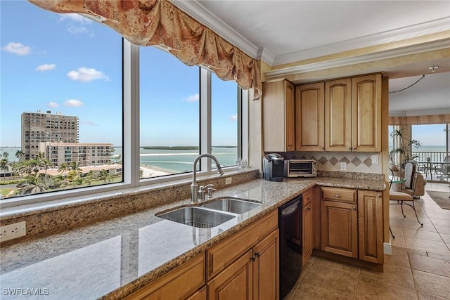 kitchen featuring light stone countertops, black dishwasher, a water view, brown cabinets, and a sink