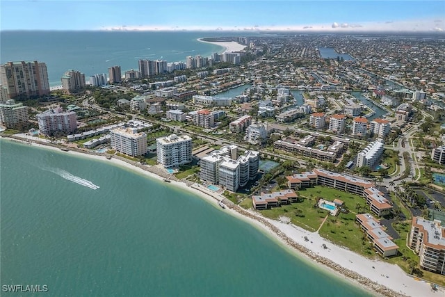 aerial view with a view of the beach, a city view, and a water view