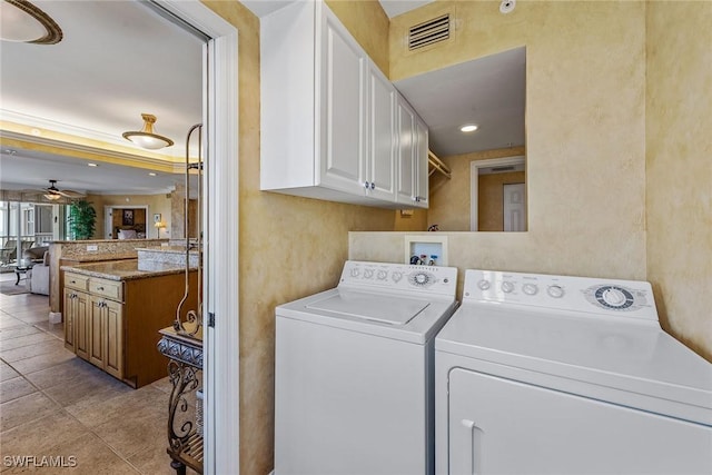 washroom with independent washer and dryer, light tile patterned flooring, cabinet space, a ceiling fan, and visible vents