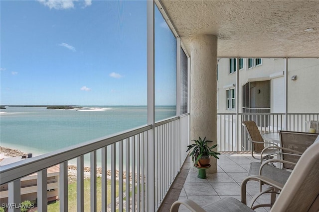 balcony featuring a water view